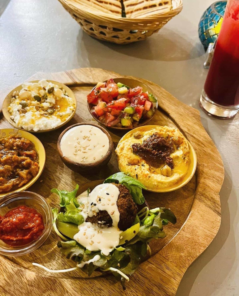 Tajine-Sprouted Hummus, Za’alouk, Falafel, Moroccan salad with Harissa and pita bread